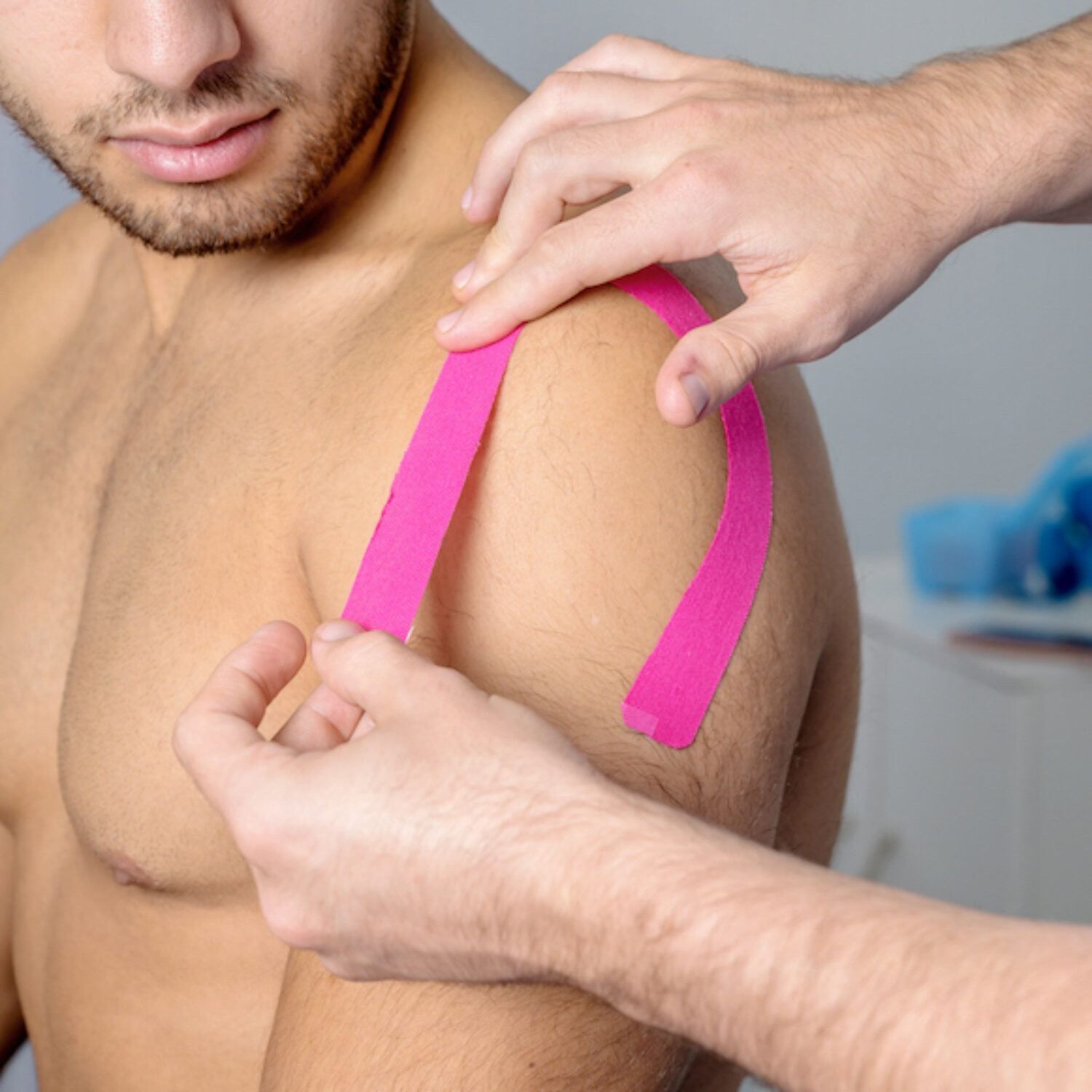 Physical therapist applying kinesio tape on male patient knee. Kinesiology, physical therapy, rehabilitation concept. close up. High quality photo